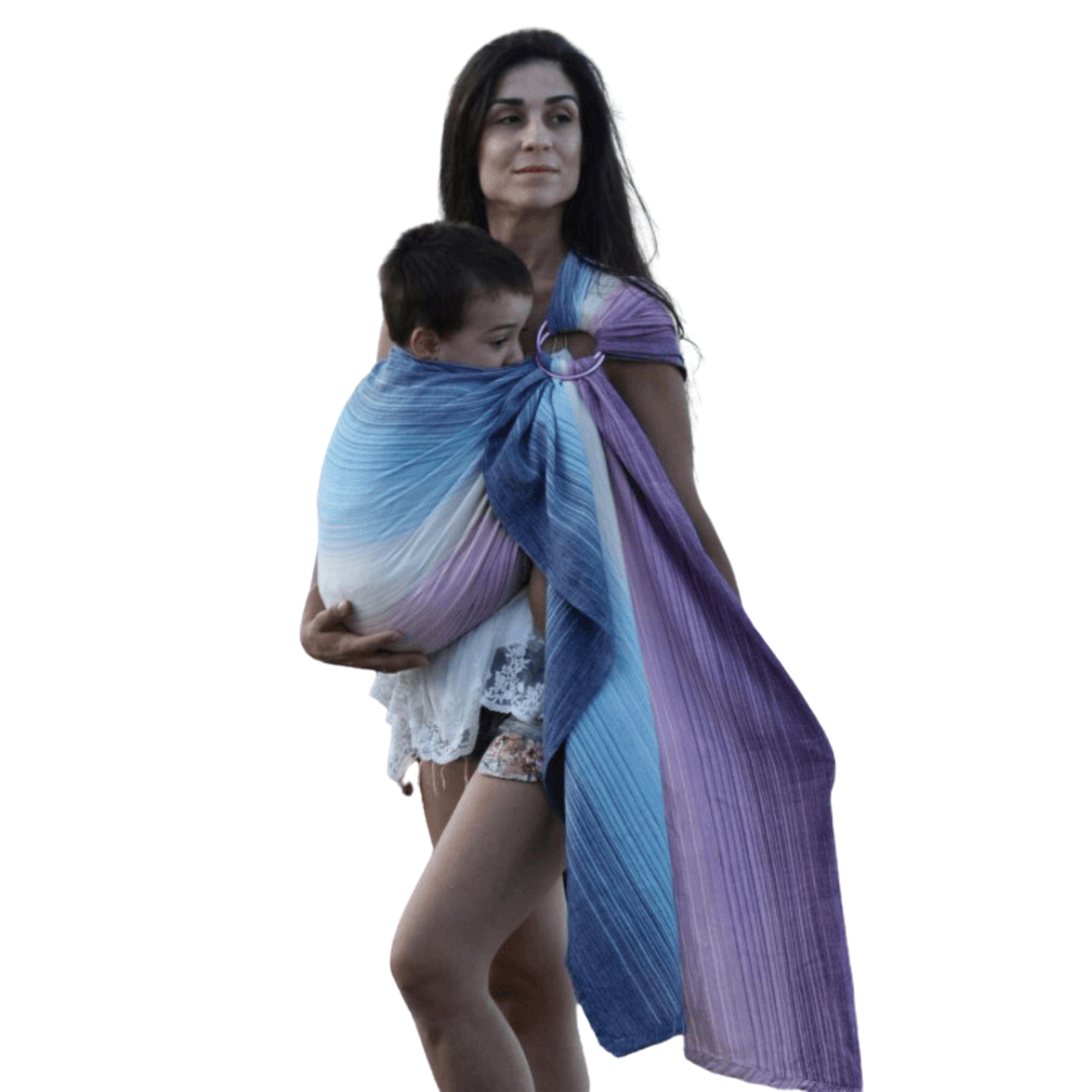 A mother wearing a colorful Girasol ring sling with a baby. The handwoven fabric features vibrant stripes, offering a soft and supportive babywearing experience with an artisanal touch