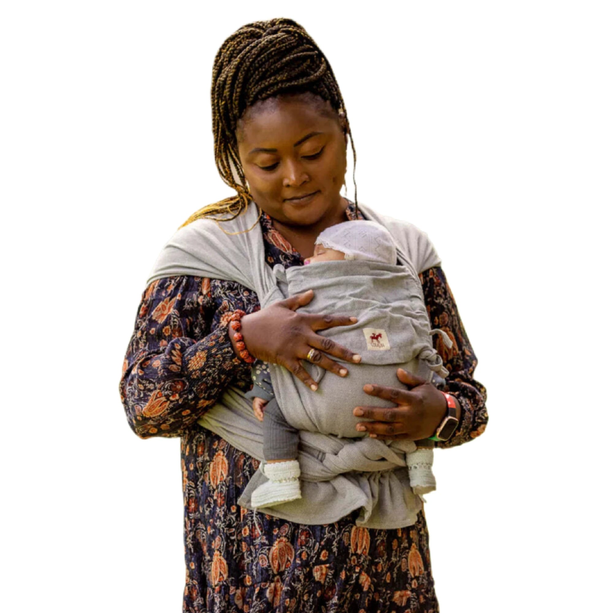 Woman wearing Girasol baby carrier in an earthy neutral color, handcrafted by artisans in Guatemala and Mexico.