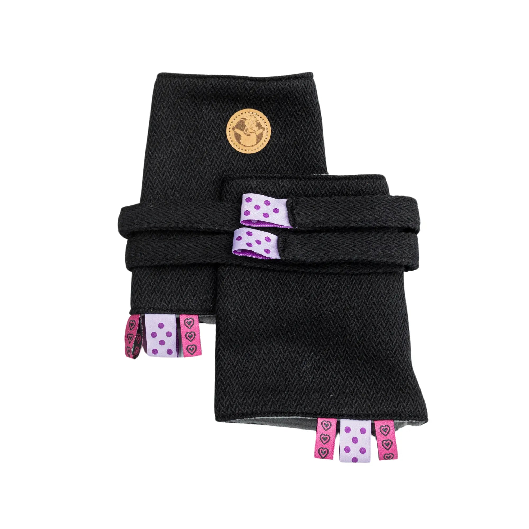 Soft and absorbent LennyLamb drool pads attached to a baby carrier, providing protection from drool and teething.