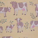 Pattern of cows and calves on a yellow beige background
