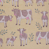 Pattern of cows and calves on a yellow beige background