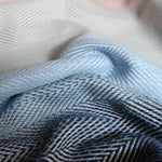 Lisca Opal Woven Wrap by Didymos, herringbone weave detail in blue and navy