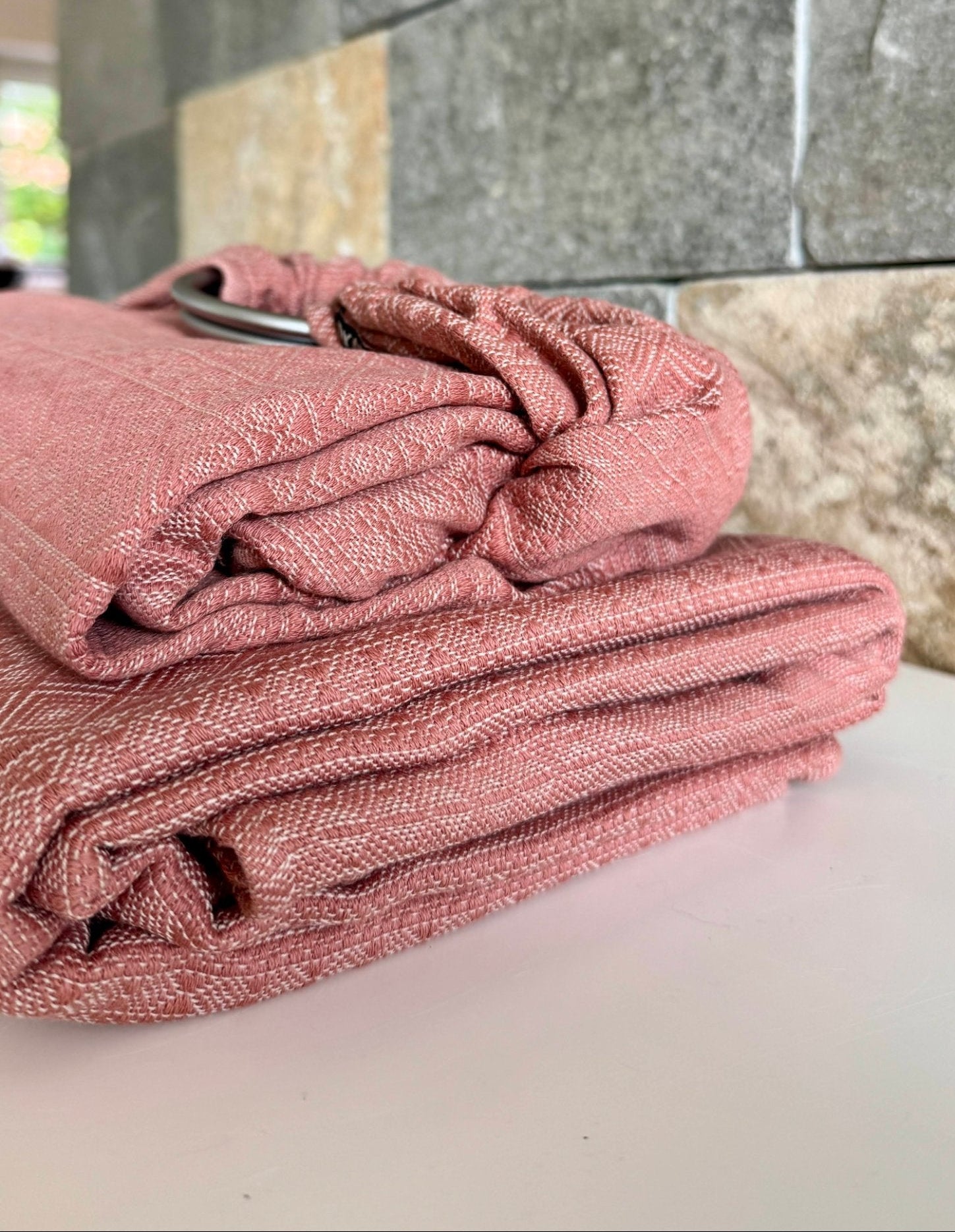 Prima Rosewood by Didymos, the woven wrap and DidySling folded and stacked