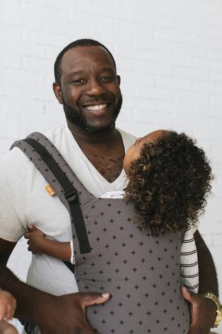 Grown man cheap in baby carrier